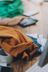 Fototapeta premium Asia people SME owner or retail fabric craft store work in artist studio home office on desk busy learn online study art class on laptop in digital dress color screen app write job idea skill on web