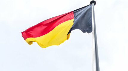 German flag waving outdoors on a cloudy day.  Possible use patriotic imagery for news or travel