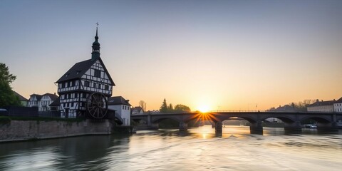 Obraz premium Half-timbered house in the middle of the river with two bridges, under a gruesome sunrise in Bamberg, Bavaria, Germany, landmark, bridges, Bavaria