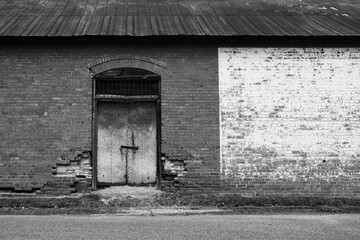 door shuttered old, abandoned building