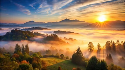 Obraz premium Early morning misty landscape with a rising sun over mountains and trees in the foreground, outdoors, mountain, outdoors