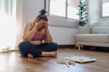 Obese Woman with fat upset bored of dieting Weight loss fail  Fat diet and scale sad asian woman...
