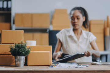 Portrait of Starting small businesses SME owners female entrepreneurs working on receipt box and...