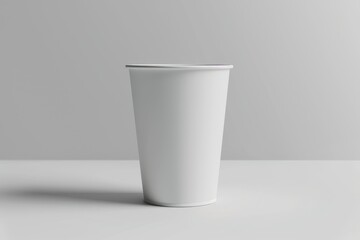 Blank white disposable paper cup on white background. (1)