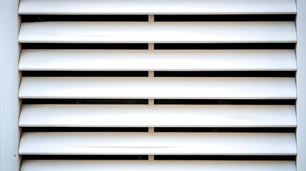 Obraz premium White ventilation slats on building exterior, close-up view. Useful for architectural or design projects