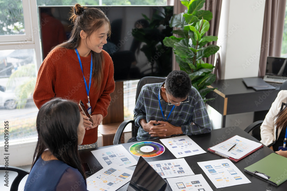 Wall mural group of software engineers design ux/ui for applications on smartphone/laptop