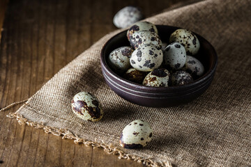 Quail eggs on wooden background