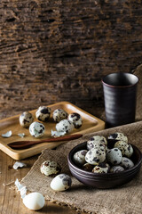 Quail eggs on wooden background