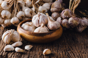 Garlic on a wooden floor background