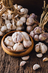 Garlic on a wooden floor background