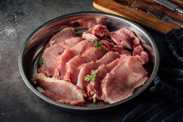 Sliced ​​pork Sliced ​​pork with a wooden cutting board on the table