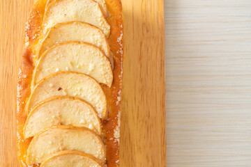 apple loaf crumbled on wood board