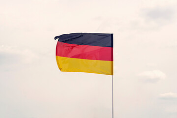 Germany flag on cloudy sky with clipping path. close up waving flag of Germany. flag symbols of Germany.