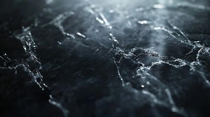 A dark, marbled surface with intricate white cracks and veins create a captivating, abstract pattern, showcasing the natural beauty and inherent texture of the material.