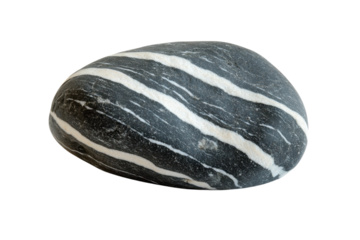 Unique striped stone showcasing natural geological patterns found on a beach during sunny weather