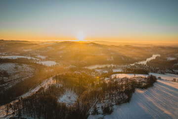 Golden Hour in a Snowy Forest