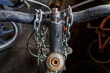 Bicycle Handlebar and Chain Wrapped in Spider Webs