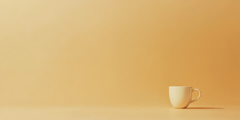 Simple white cup on a softly lit orange surface creating a minimalist aesthetic effect