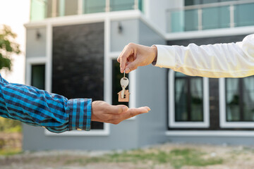 lease, rental and selling home. Real estate agent manager smile holding key for new owner. rent house, Sales, loan credit financial, insurance, Seller, dealer, installment,  buy, sell, move in
