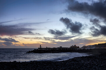 Atmospheric sunset at the harbor in Funchal (Maderia, Portugal)