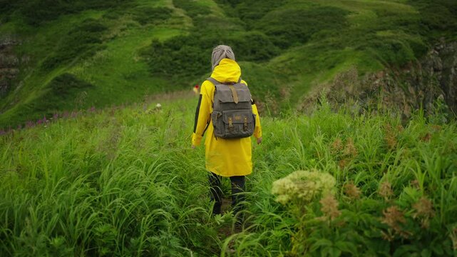 Woman Backpacker Walking Alone In Mountains, Admiring Landscape From Top, Freedom And Enjoyment
