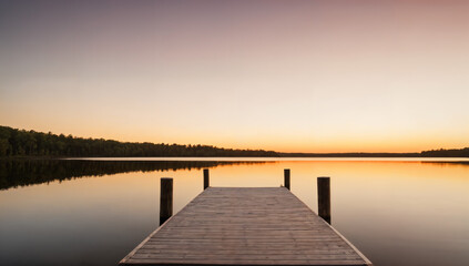  A tranquil dock leading to a peaceful sunset over the lake