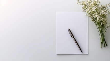 Financial Foundations: Loan, Interest, and Agreement, Blank paper and pen beside delicate white flowers on a light background.