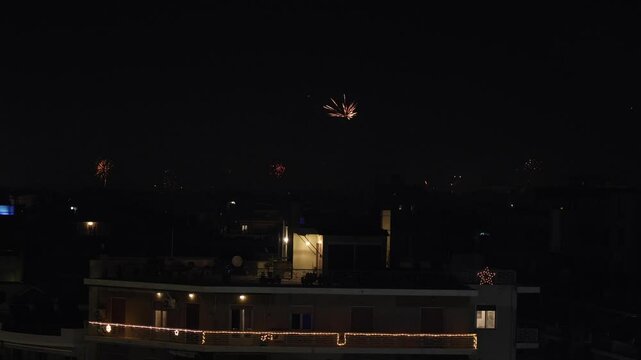 New Year Eve in Athens. 4K video with fireworks over the city skyline in Athens during 2025 New Year in Greece.