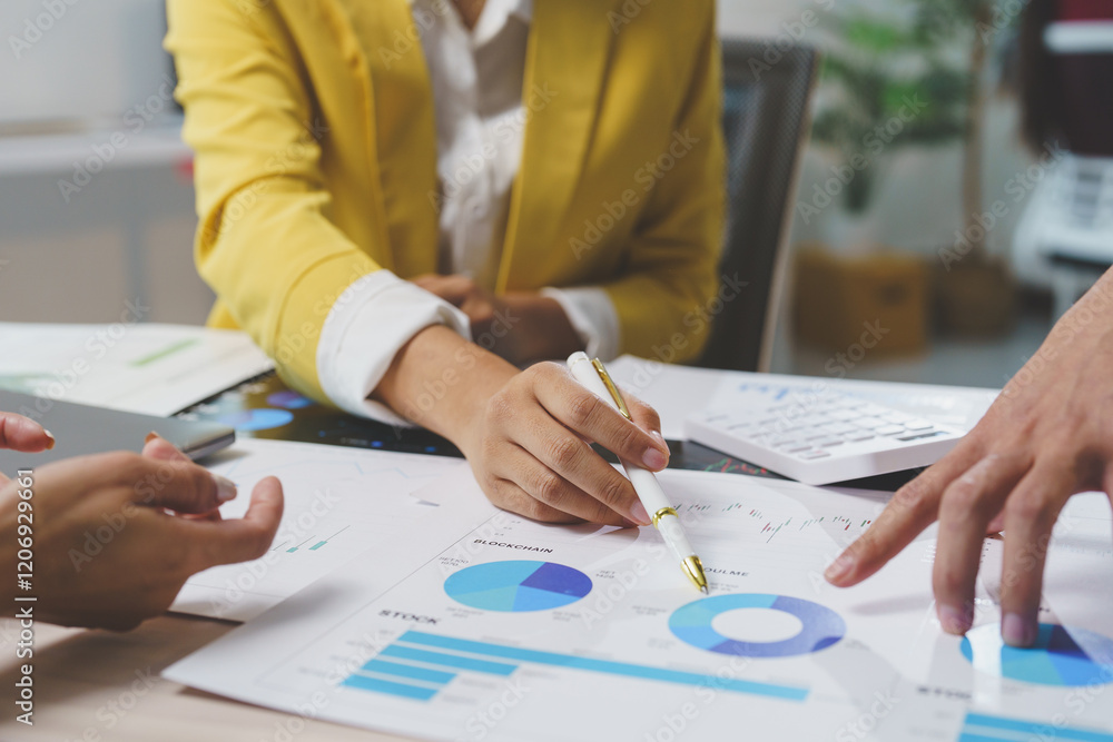 Poster business team analyzing financial charts and graphs using pen and calculator during a meeting in the