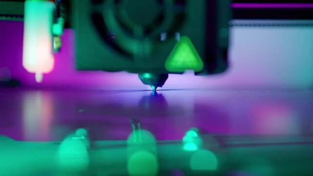 3d printer prototyping machine printing plate surface from above print filament layer neon lights