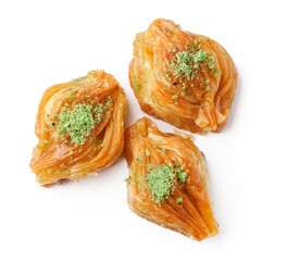Delightful traditional dessert made of layers of dough filled with nuts and syrup served on a white background