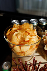 glass bowl filled with potato chips.