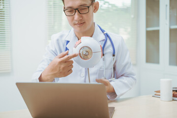 Male doctor specializing in eye diseases, providing consultations at a hospital, discussing eye...