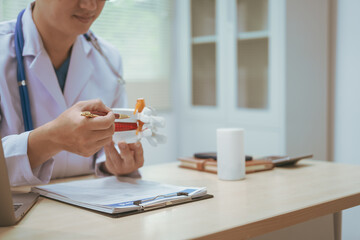 Male doctor treating bone diseases at a hospital, discussing scoliosis, herniated discs, osteoporosis, diagnosing bone density issues, and providing treatment plans for brittle bones, fractures