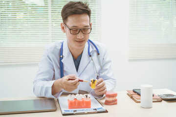 Male doctor treating dental diseases at a hospital, discussing tooth decay, crooked teeth broken teeth,cracked teeth, gum inflammation, and wisdom tooth pain, providing treatment plans, patient care