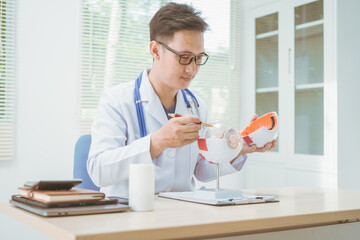 Male doctor specializing in eye diseases, providing consultations at a hospital, discussing eye...