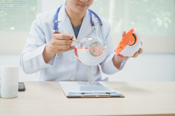 Male doctor specializing in eye diseases, providing consultations at a hospital, discussing eye...
