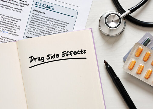Doctor considering drug side effects while reading medical report