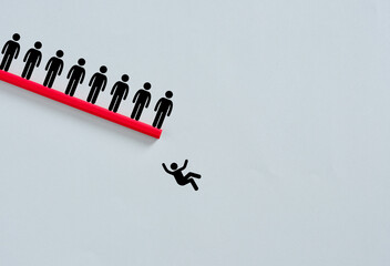 Businessman falling from red pencil bridge with other businessmen watching