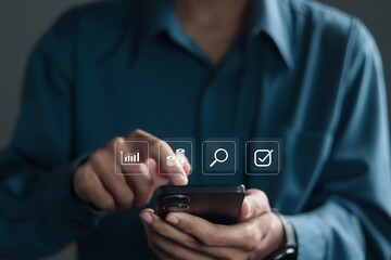 Financial evaluation concept, Businessman using smartphone with financial evaluation icon on virtual screen. Auditing and evaluating the organization's financial statements