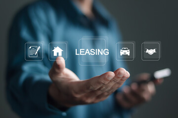 Leasing business concept, Businessman showing LEASING icon on virtual screen. Contract management,...