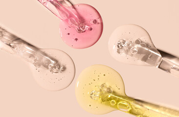 samples serum tests glass pipettes with drops of serum on a light beige background