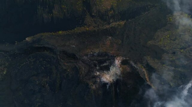 A dramatic bird&rsquo;s eye view of Paricutin Volcano in Michoacan, Mexico, showcasing the dark and ominous caldera and rugged topography. A striking glimpse into the raw power of nature.