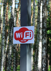 Free wireless internet zone in a remote forest area vertical stock image
