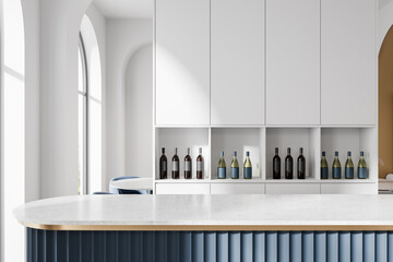 Modern kitchen interior with white cabinets, wine bottles, and a blue island countertop design. 3D Rendering