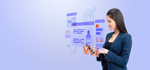 Woman interacting with virtual KYC interface on a phone.