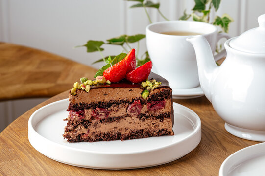 chocolate cake with cream and fresh berries