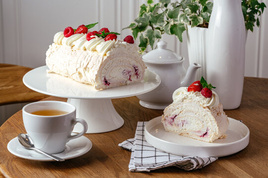meringue roll with berries on a plate