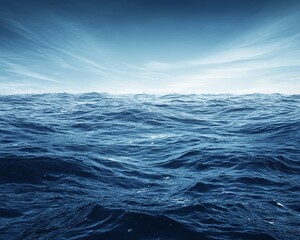 Fototapeta premium Vast ocean with blue waves under a cloudy sky.