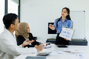 Diverse colleagues collaborative brainstorming at office briefing, Young Business Asian people explaining analysis at the meeting Multiethnic startup work.	